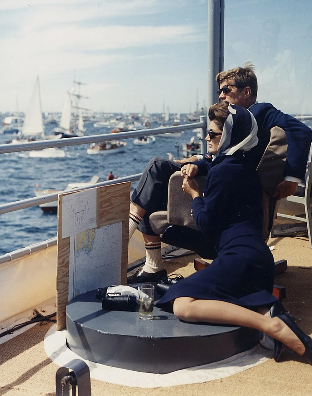 John and his wife, Jackie Kennedy, watch a boat race while on board the USS Joseph P. Kennedy Jr., a destroyer named in Joe Jr.'s honor